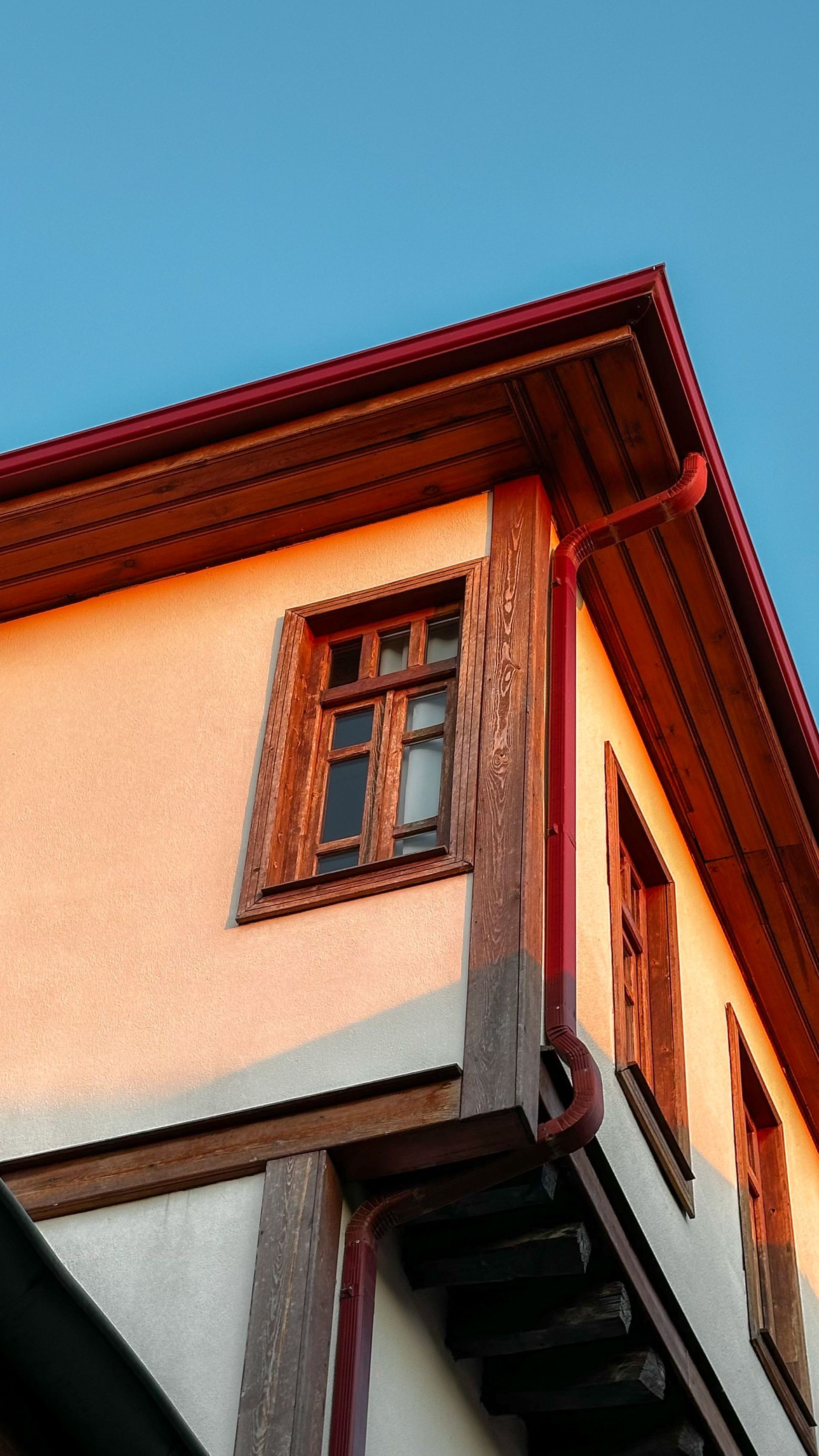 A traditional house in Hamamönü, Ankara, showcasing wooden details and sunset lighting.