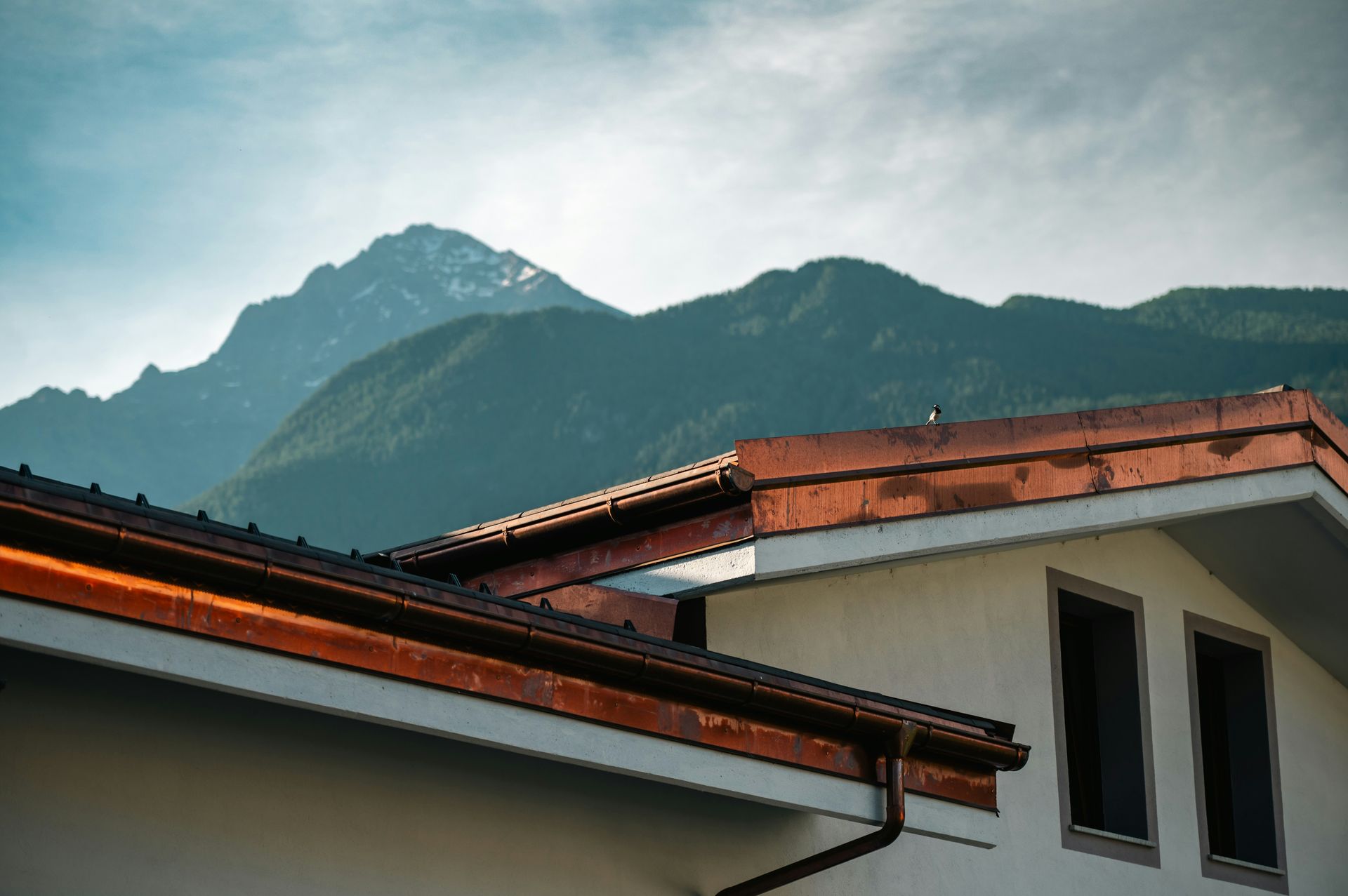 A house with a mountain in the background