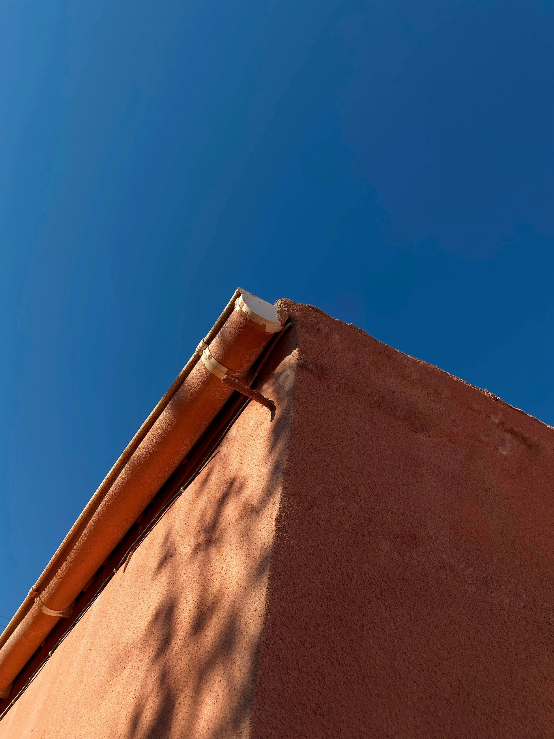 a sand dune with a blue sky