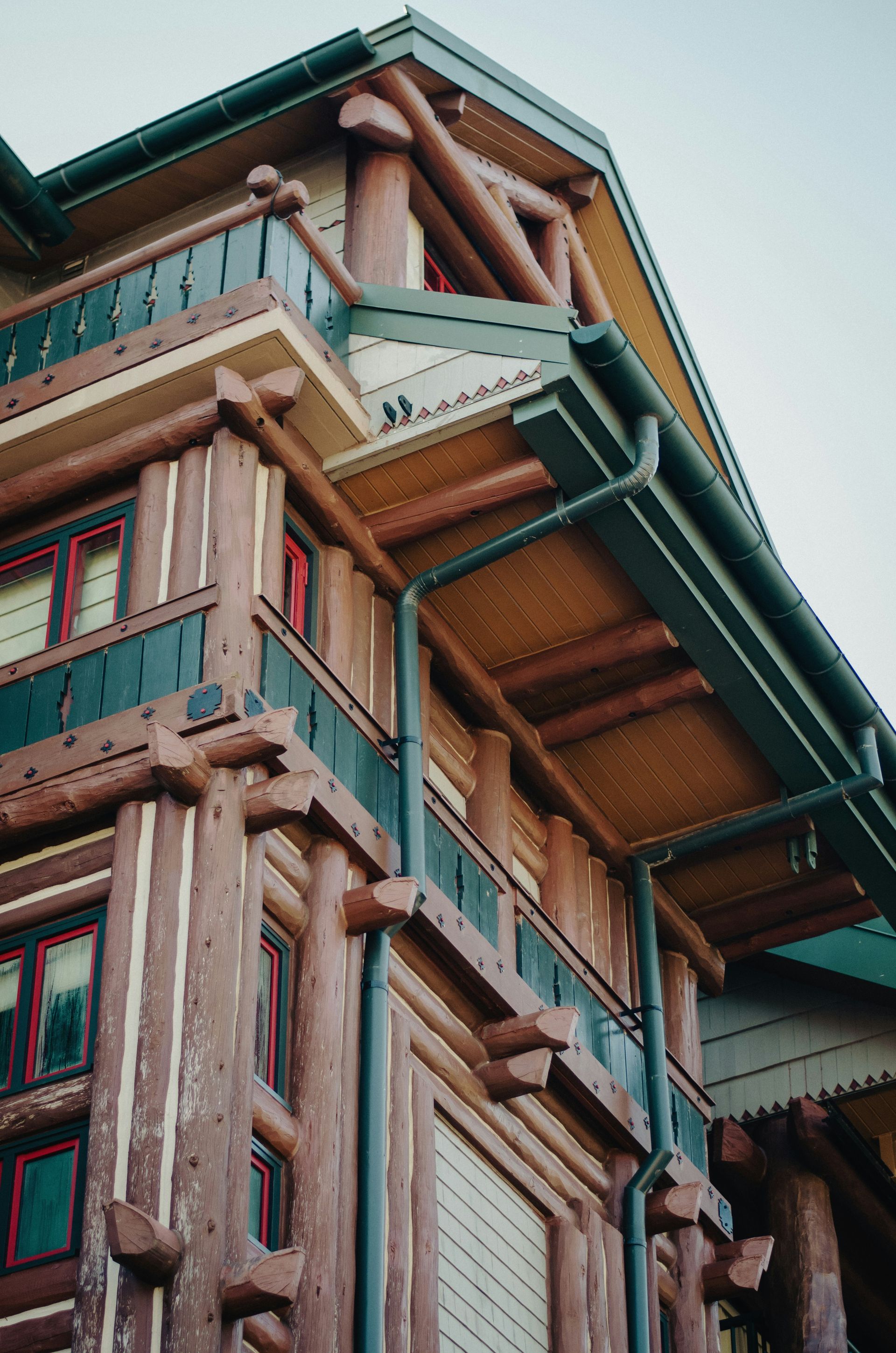 a tall wooden building with lots of windows